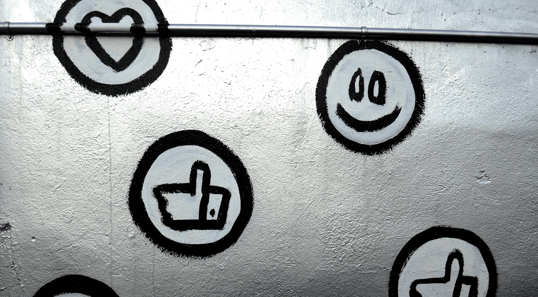 Social media icons spray painted on a silver wall